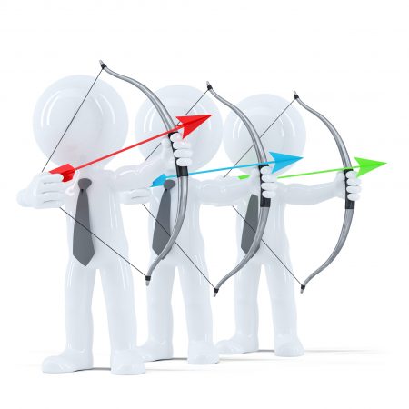 Group of businesspeople aiming at a target. Isolated over white background